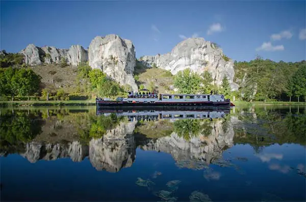 A barge cruising along the River Yonne